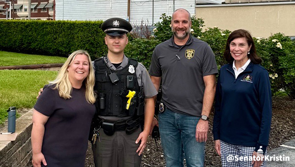 Rep. Kate Klunk and Sen. Kristin Phililps-Hill take a picture with two Hanover Borough Police Department Officers