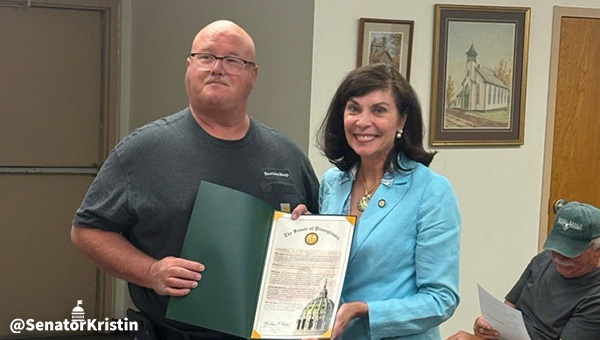 Sen. Phillips-Hill presenting a citation to Ira Walker