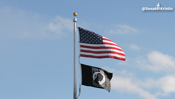 A flagpole with the U.S. Flag and POW/MIA flag underneath.