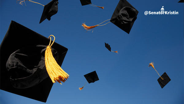 Graduation caps flying in the air.