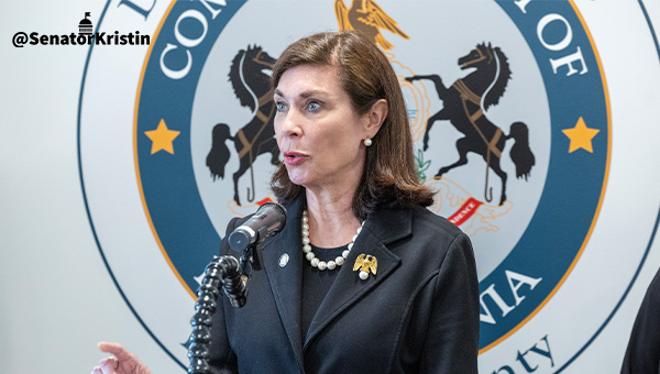 Senator Phillips-Hill speaking at a podium.