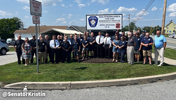 Group picture of attendees at the merger event.