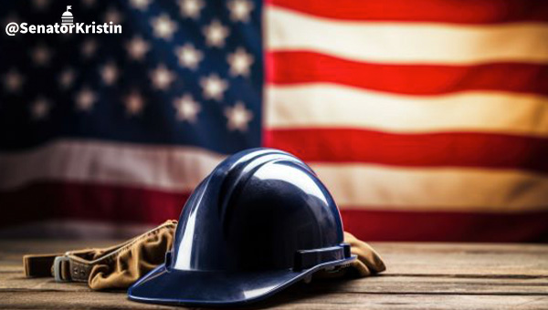 Hardhat in front of an American Flag.