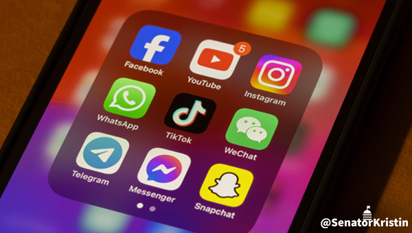 Closeup of an iPhone folder of social media apps.