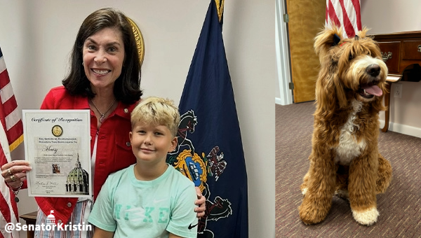 Senator Phillips-Hill with a young boy and a dog.
