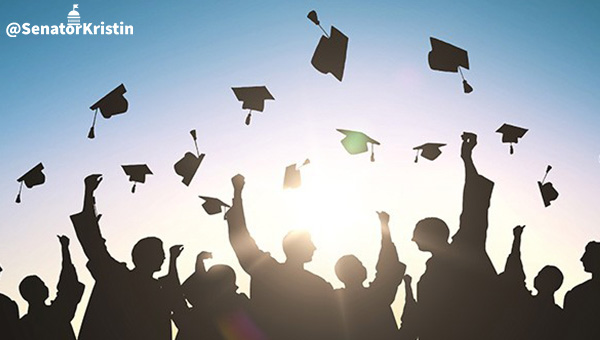 Graduates throwing their caps.