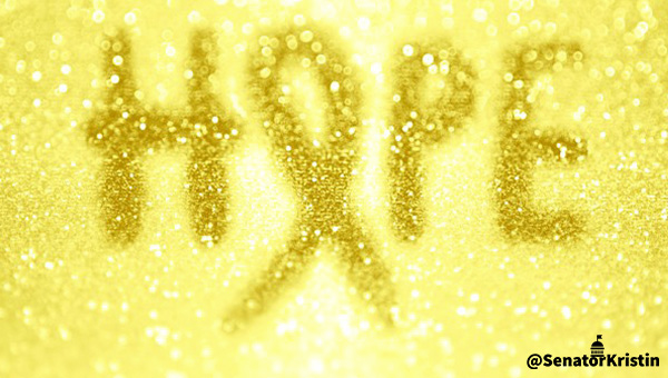 Text which reads “HOPE” with the “O” stylized as a yellow ribbon.