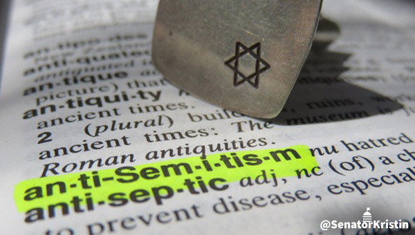 A closeup of a dictionary with the word “antisemitism” highlighted.