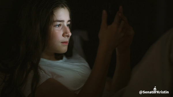Child holding a phone.
